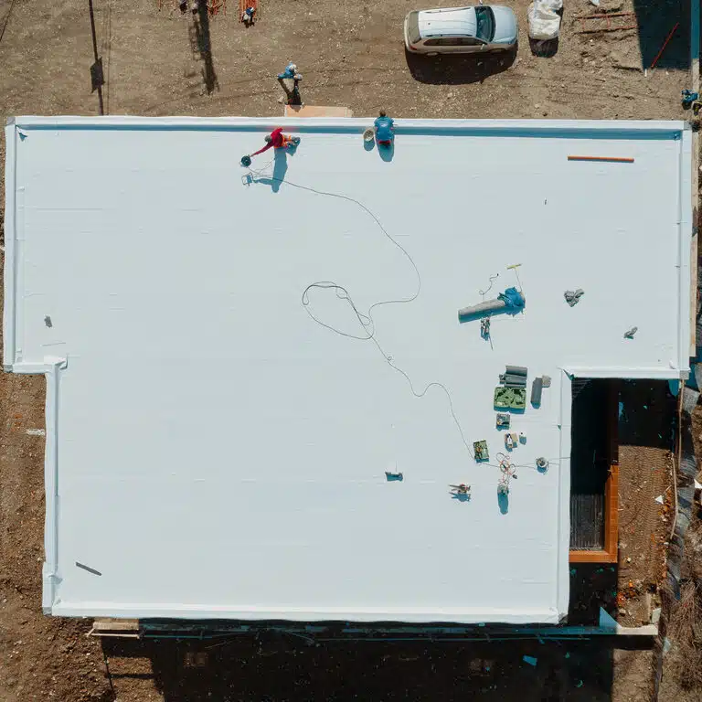 Aerial view of an apartment building with flat roof